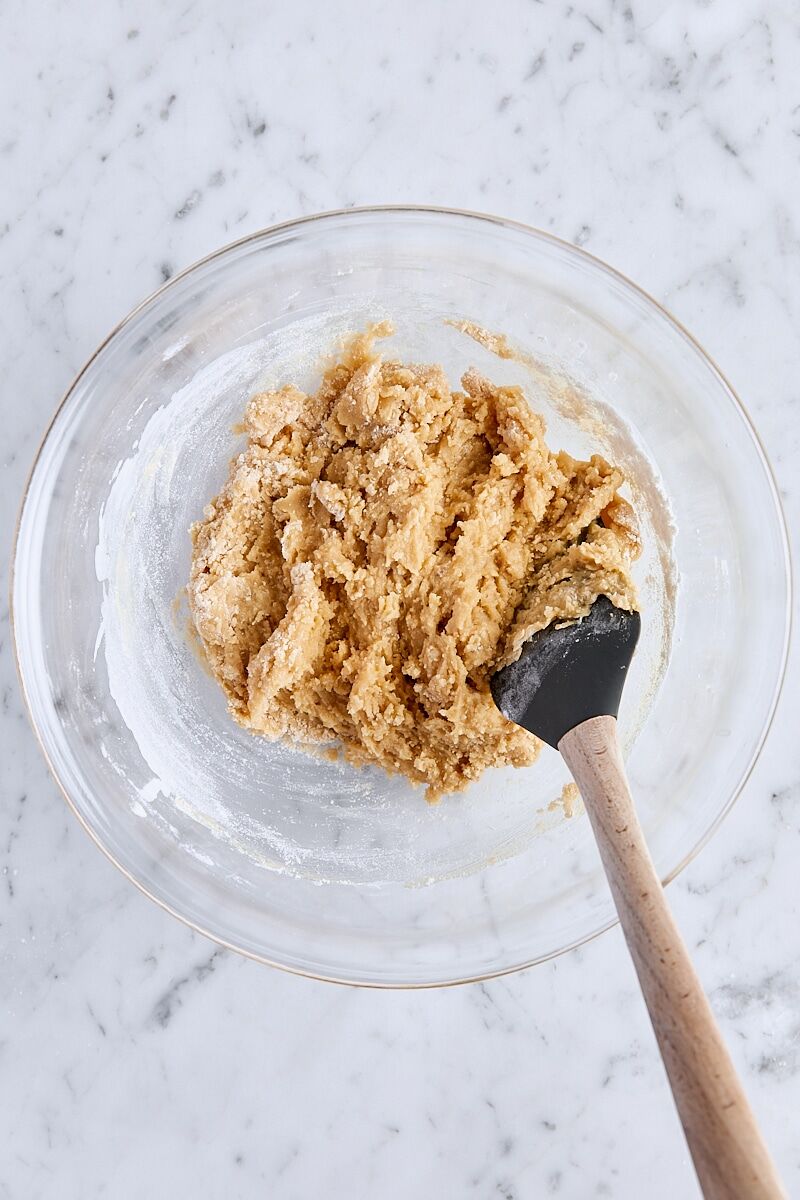 Flour folded into cookie dough with spatula