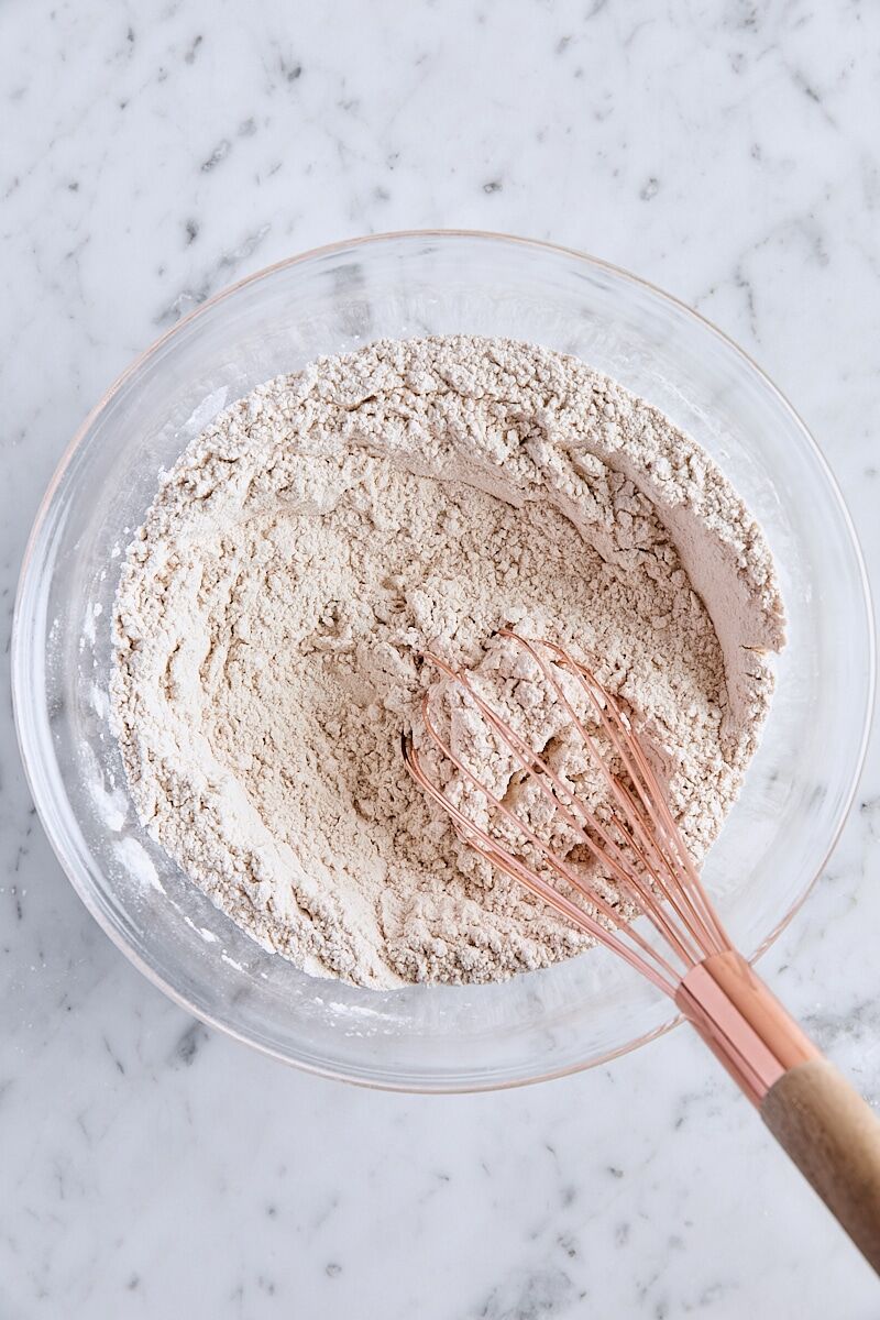 Dry ingredients combined in medium glass bowl with whisk