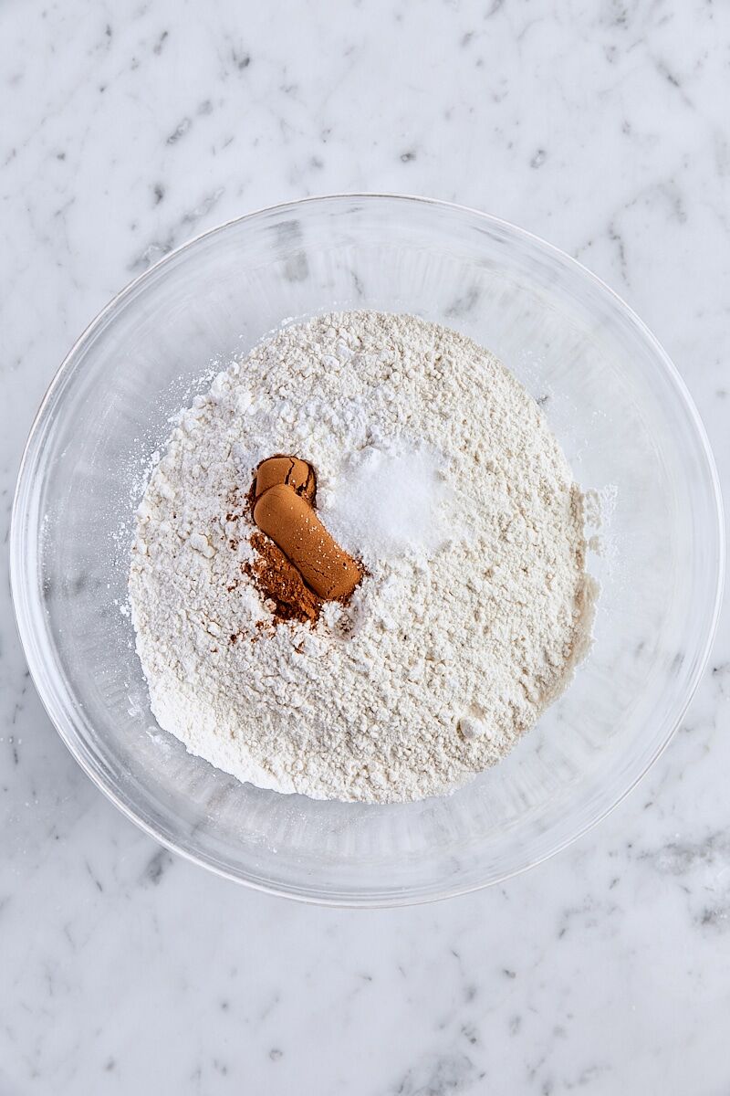 All-purpose flour, cream of tartar, baking powder, baking soda, ground cinnamon, and salt in glass bowl