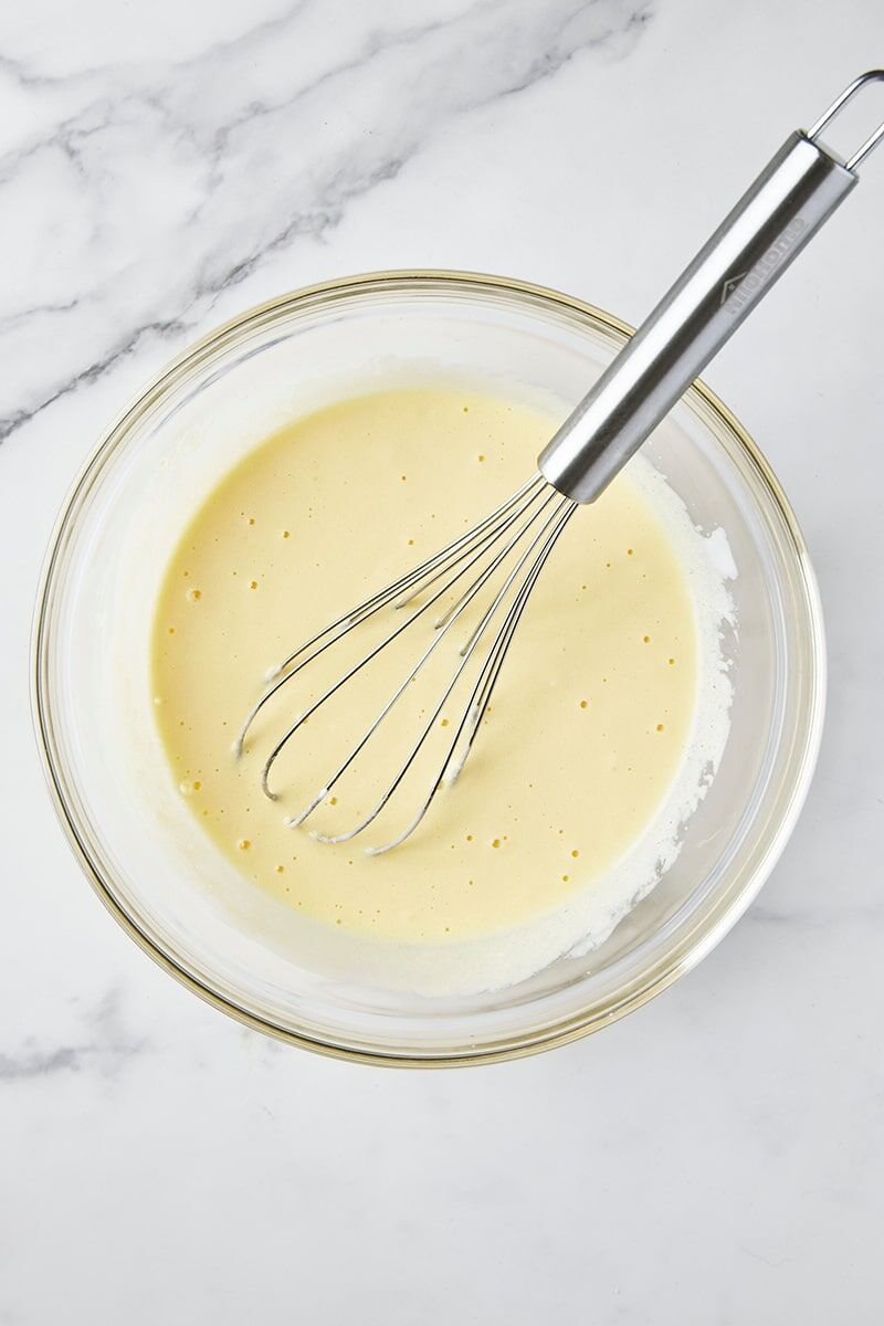 Wet ingredients whisked together in glass bowl