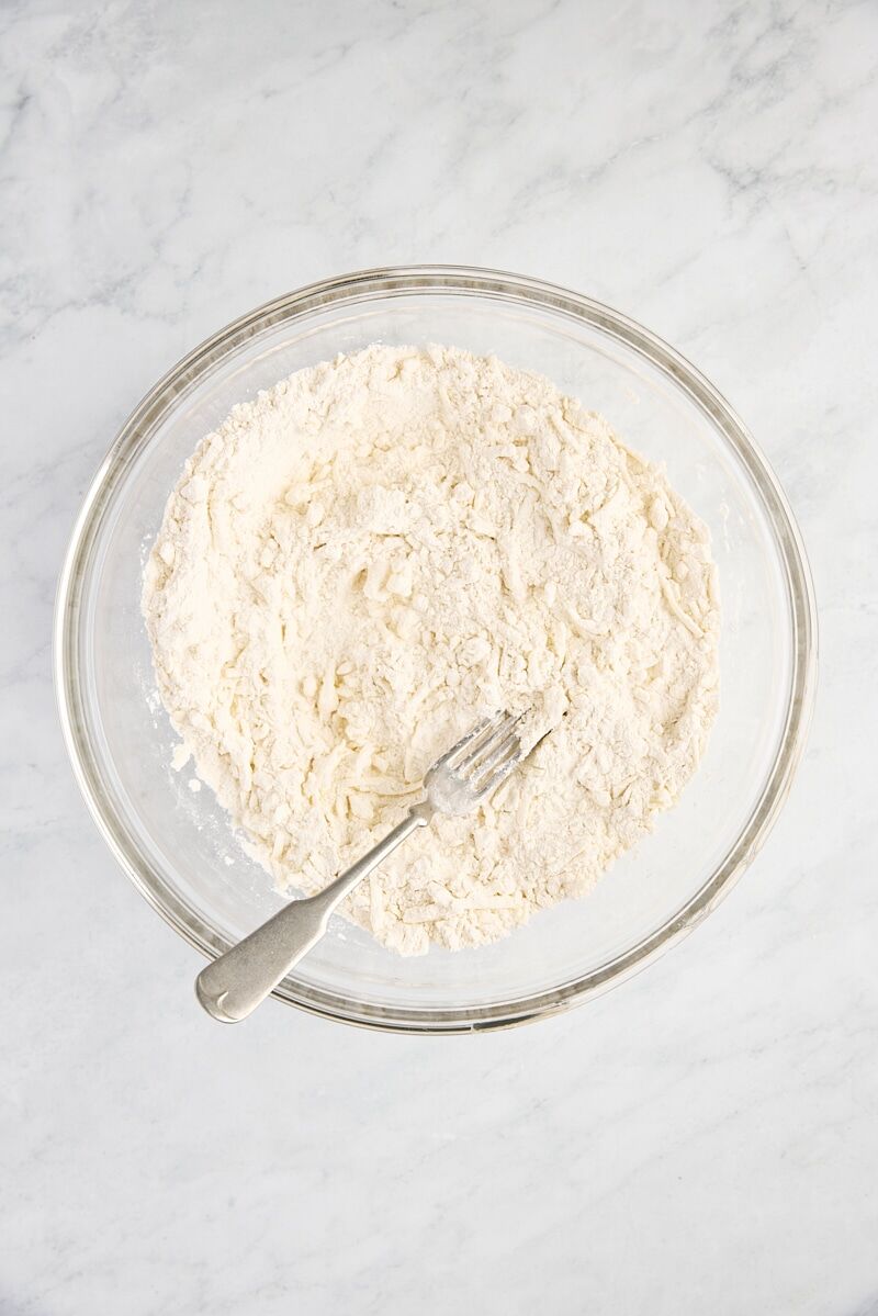 Grated butter stirred into flour mixture with fork