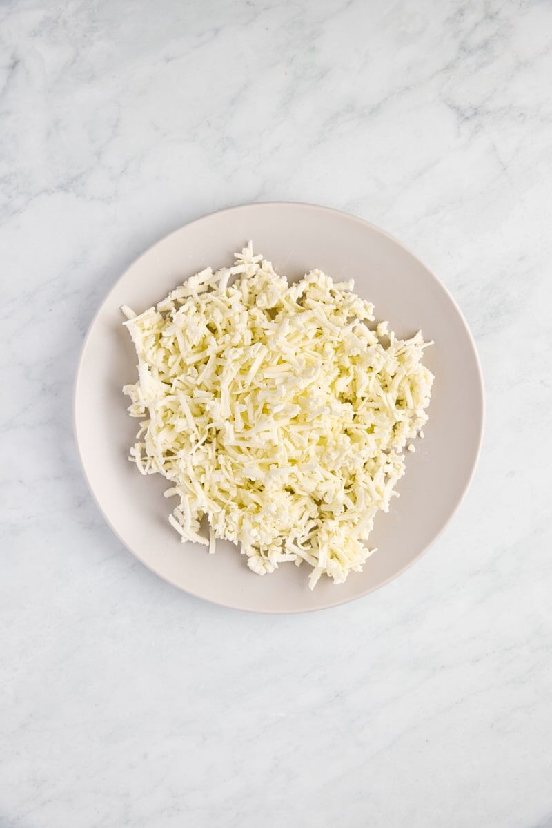 Chilled grated butter on plate