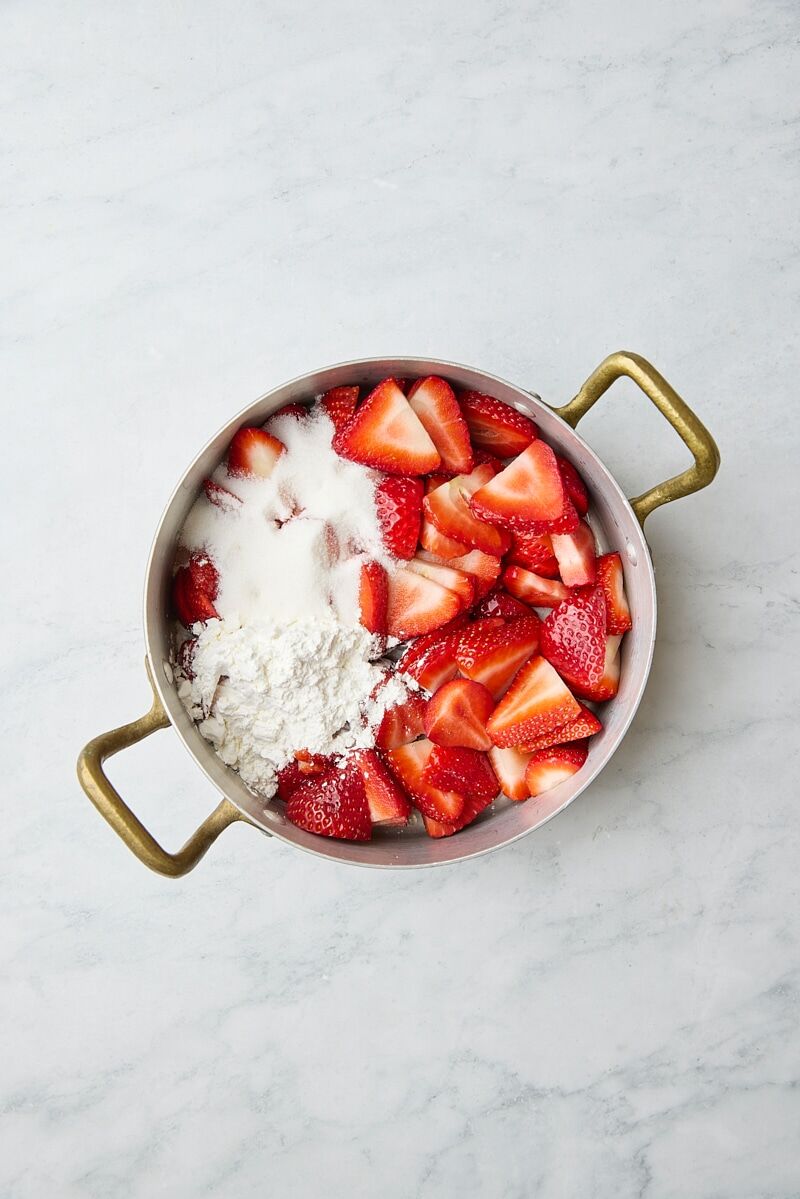 Sliced fresh strawberries, granulated sugar, cornstarch, lemon juice, and water in saucepan