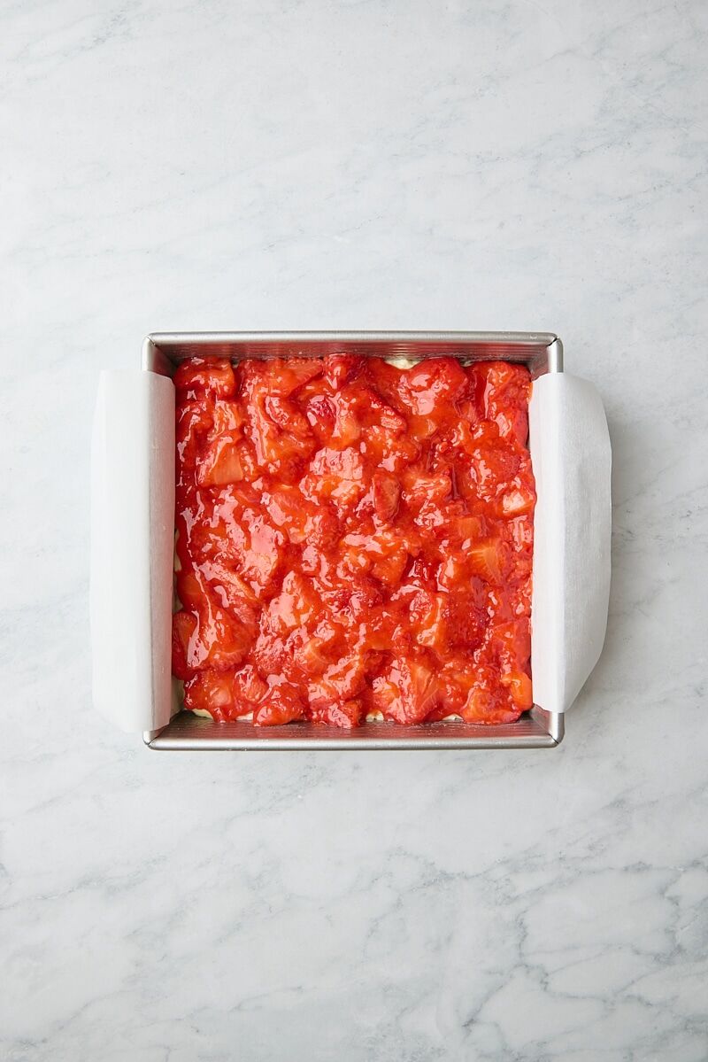 Strawberry filling layered over batter
