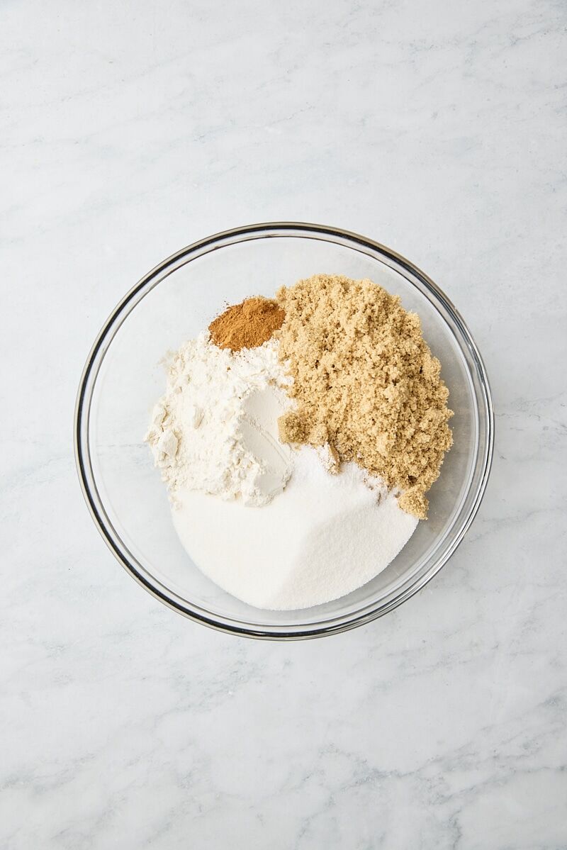 All-purpose flour, brown sugar, granulated sugar, cinnamon, and salt in a glass bowl