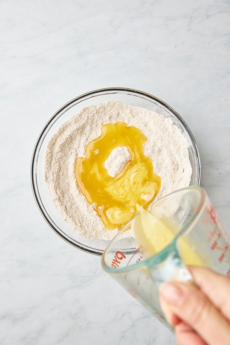 Melted butter added to crumb topping ingredients