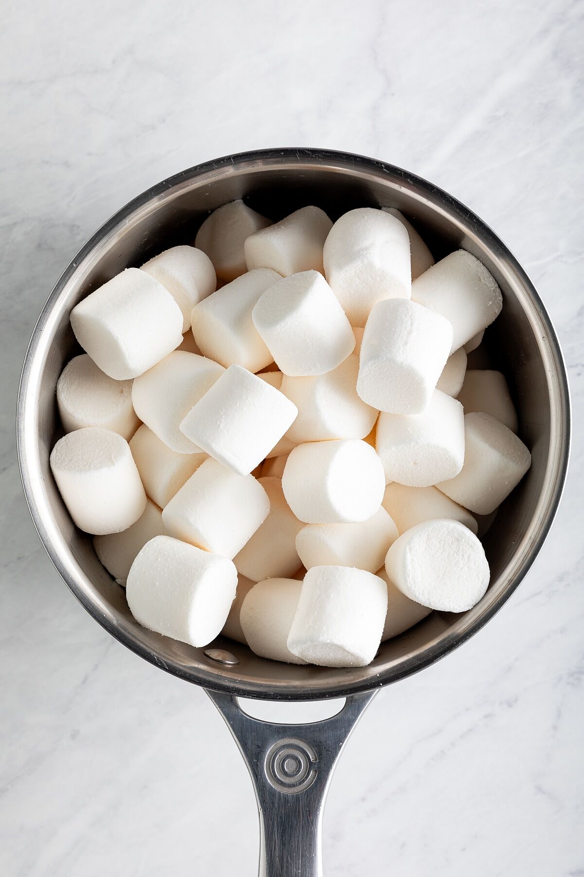 Marshmallows added to saucepan with browned butter