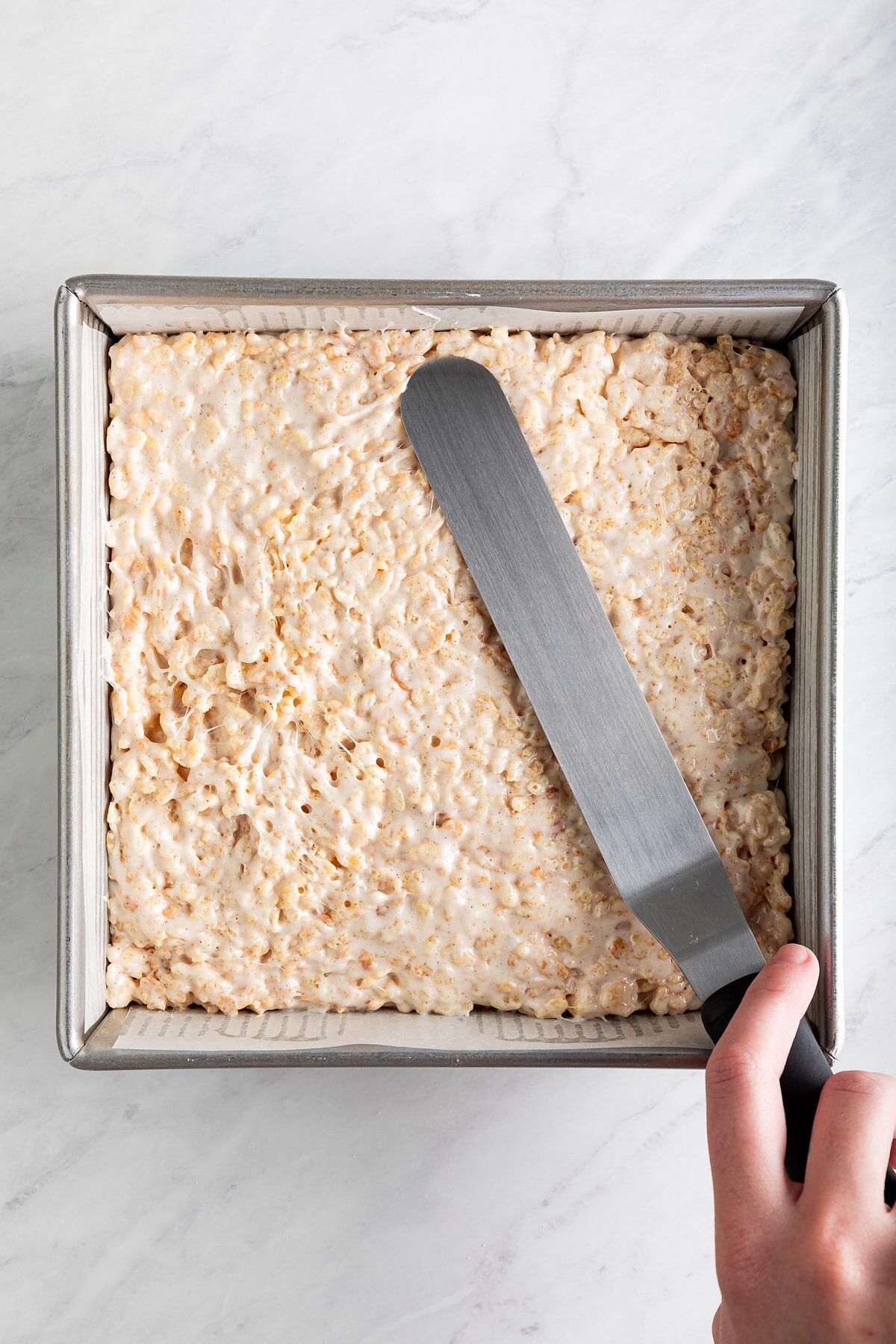 Rice krispie mixture pressed into pan