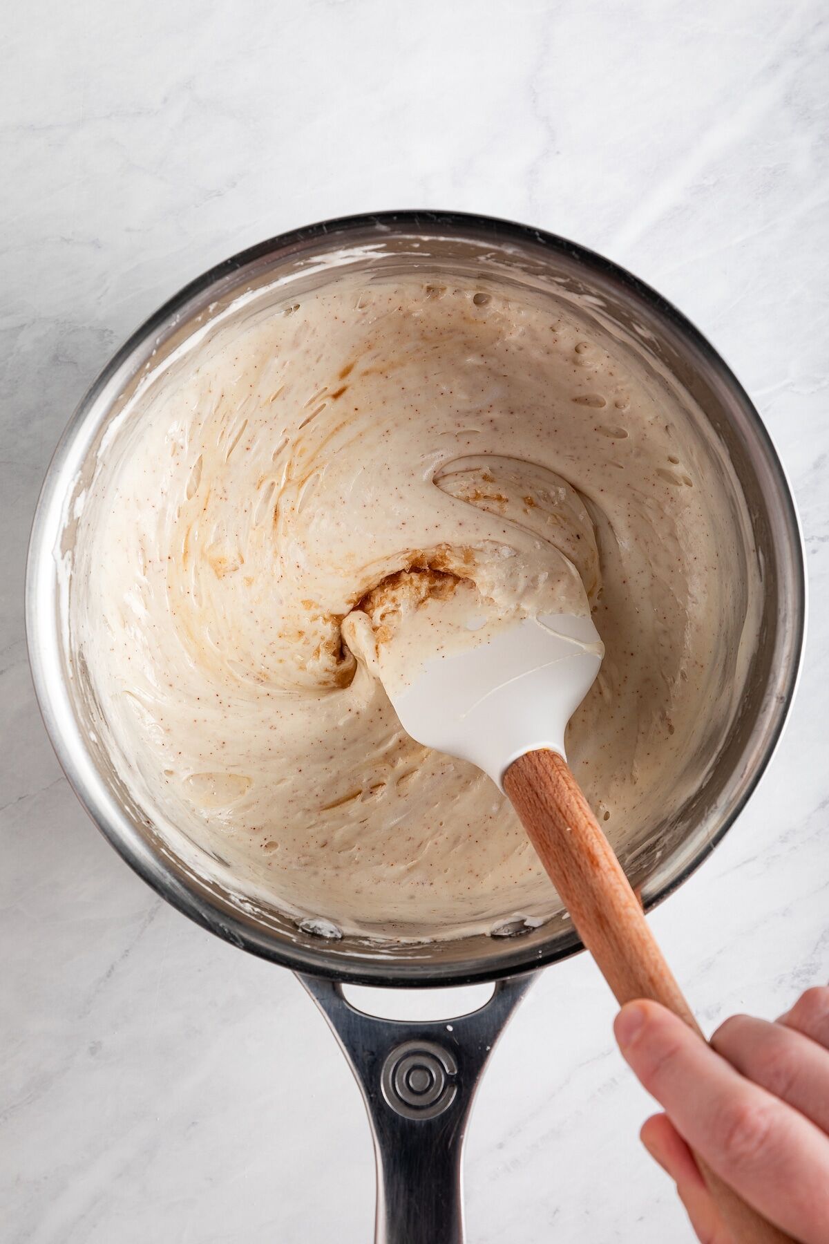 Vanilla extract and flaky salt added to melted marshmallow mixture