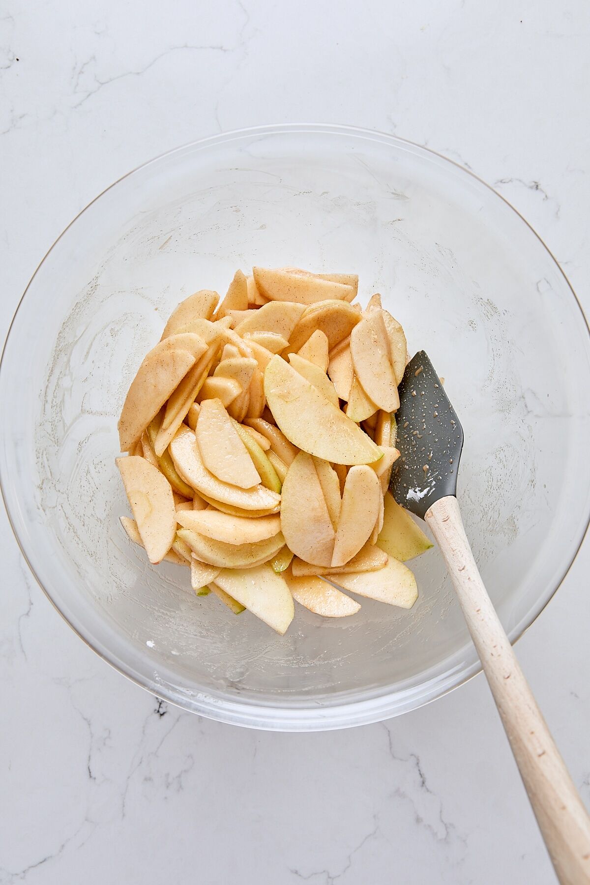 Apple galette filling in glass bowl with spatula