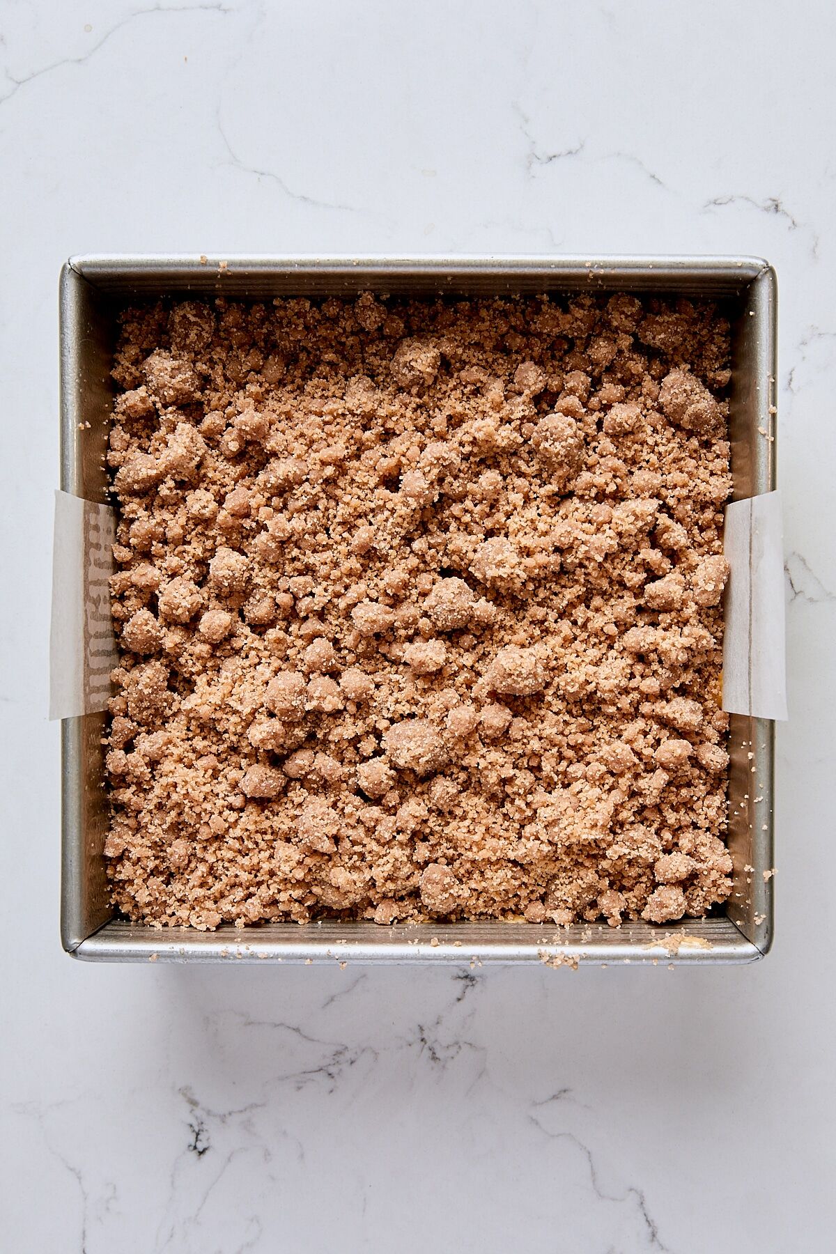 Assembled crumb cake in pan