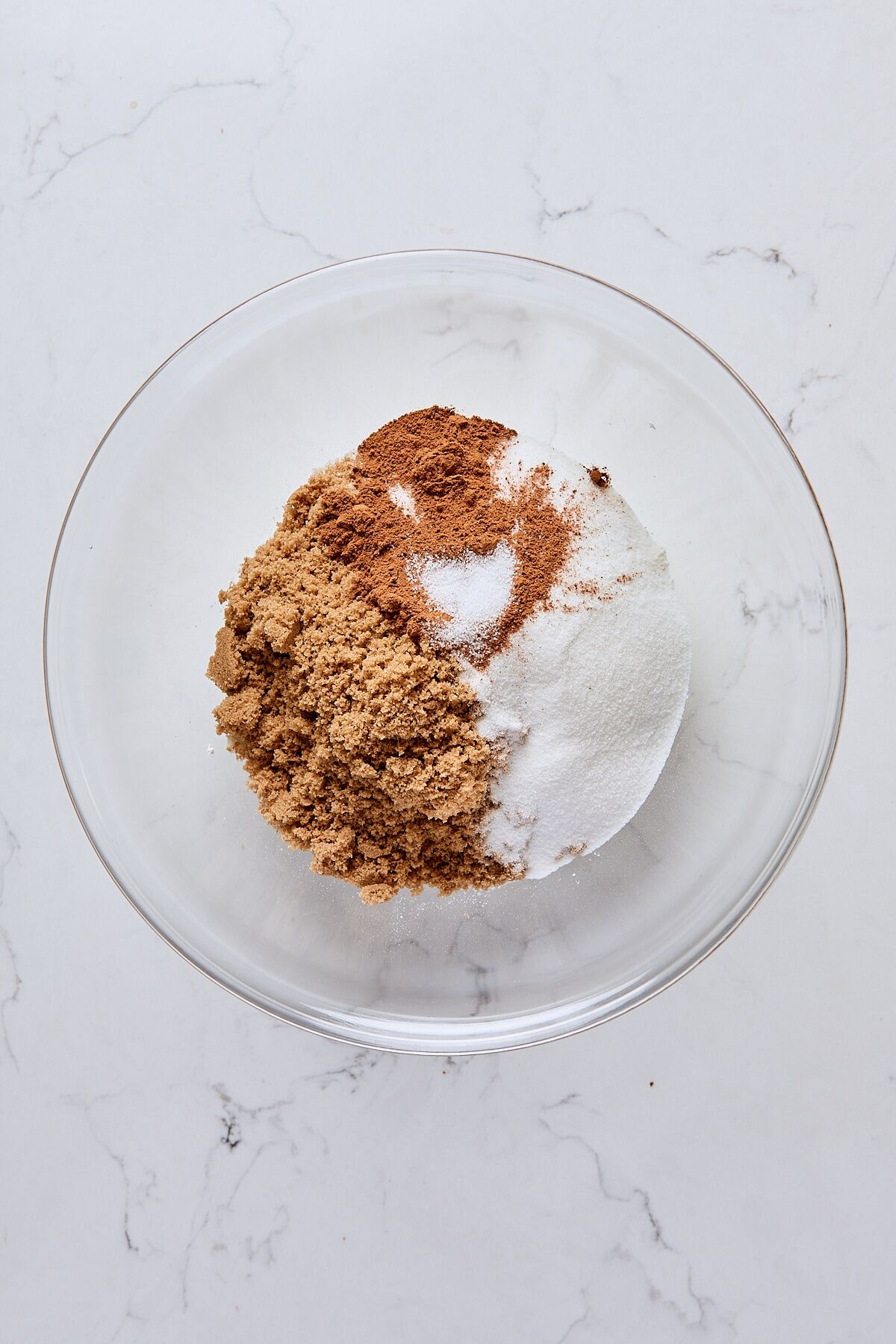 All-purpose flour, dark brown sugar, granulated sugar, cinnamon, and salt in glass bowl